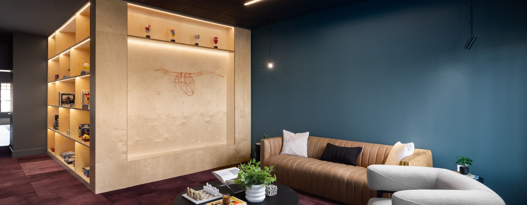 a lounge with seating and decor