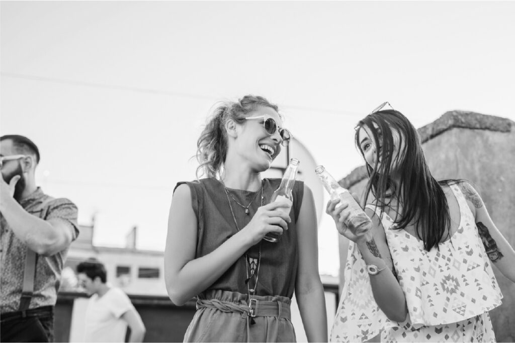 People outdoors having fun and enjoying beverages